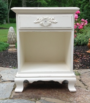 White painted nightstand with rose wreath and crystal knob